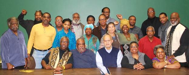 Group portrait at the conclusion of the December 21, 2013 BLUN meeting.  Seated, left to right: Ajamu Dillahunt, Saladin Muhammed, Abdul Alkalimat, Ashaki Binta, Kathy Knight. Standing, left to right: Roger Newell, J. R. Fleming, Tony Menelik Van Der Meer, Dennis Orton, Kia Van Der Meer, Sam Anderson, Shafeah Mbalia, Rose Brewer, Tony Monteiro, Toussaint Losier, Rukiya Dillahunt, Taliba Obu, Jonathan Stith, Carl Redwood, Tdka Kilimanjaro, Jamal Oliver, Akinjele Umoja.